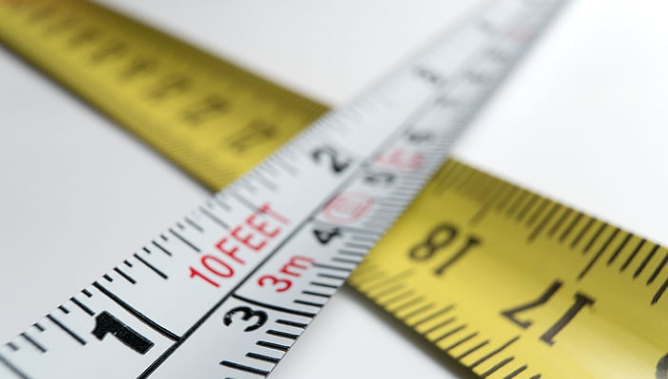 Tape measure close-up showing both inches and centimeters